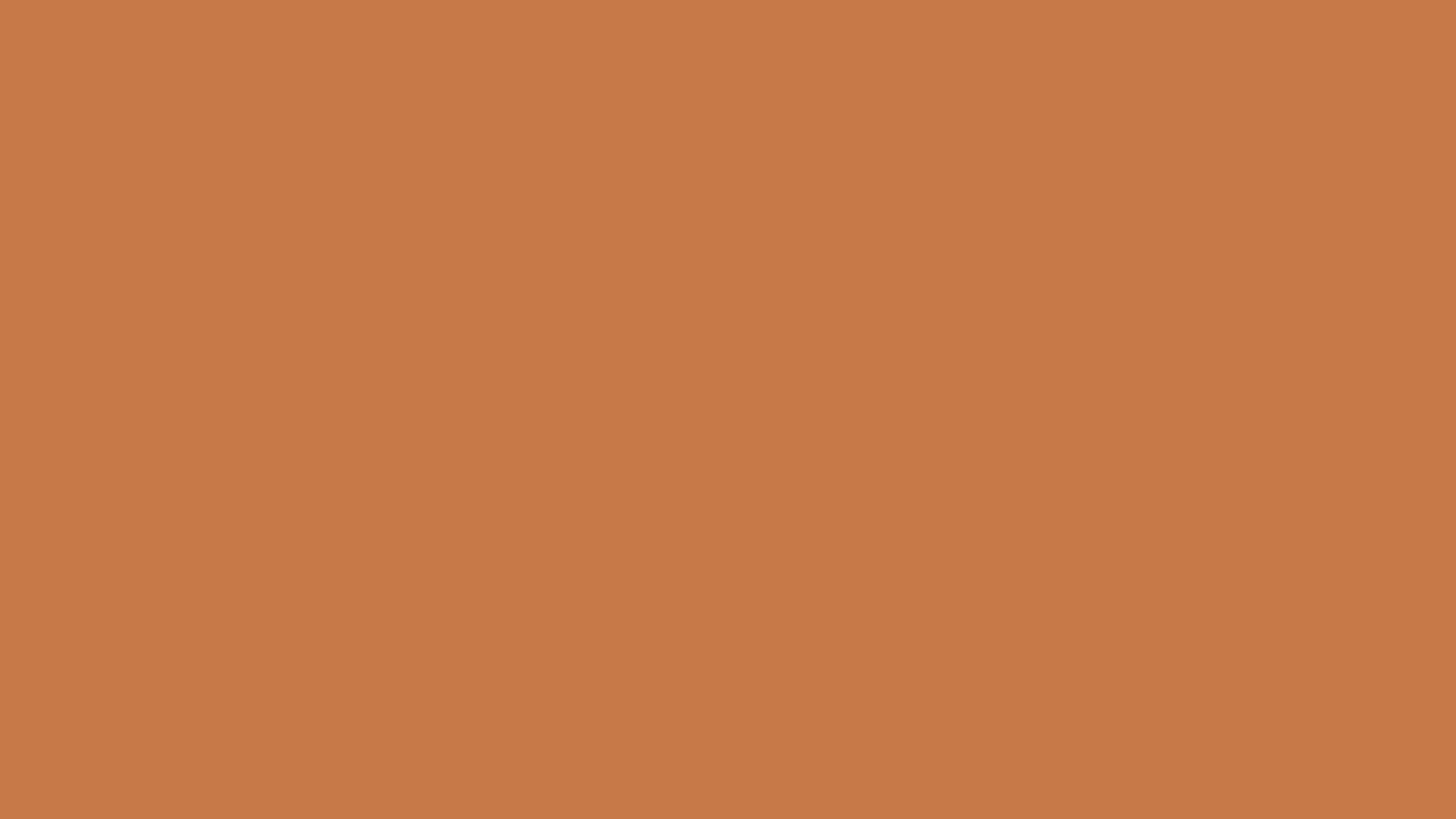 Download a free high-resolution solid color background image of Pantone 16-1346 Tcx Golden Ochre Color | Hex color Code #c77943. Ideal for wallpapers, presentations, and digital art. #solidcolor #backgroundimage #color #c77943
